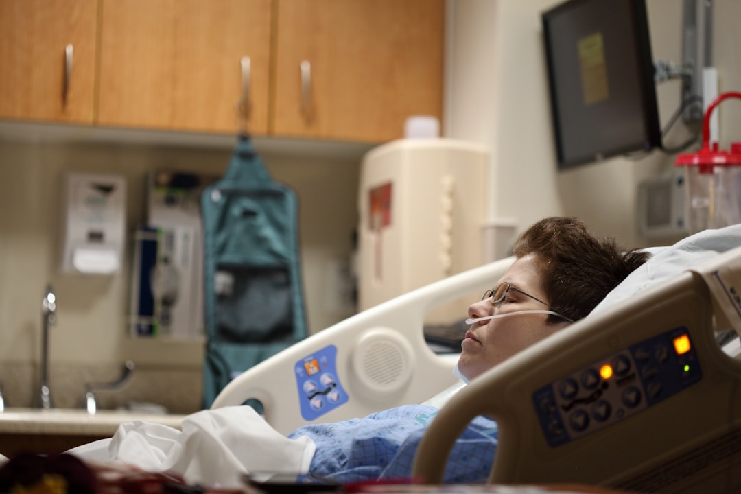 person lying in a hospital bed