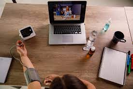 person at a desk with a laptop