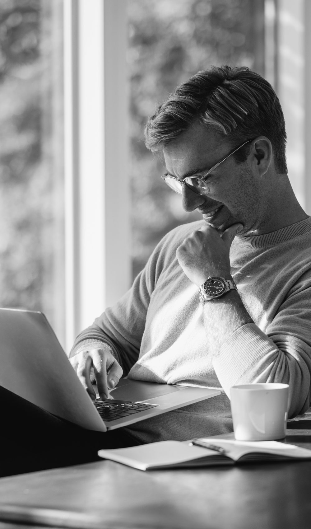 man using laptop for telehealth