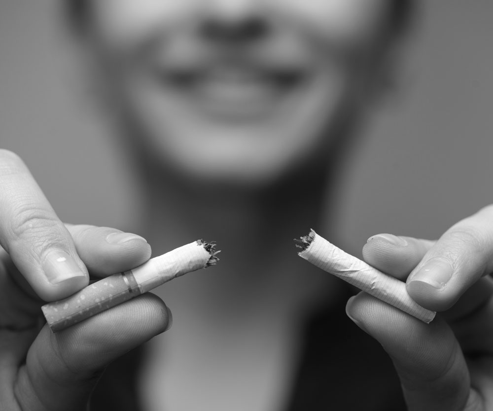 woman breaking a cigarette